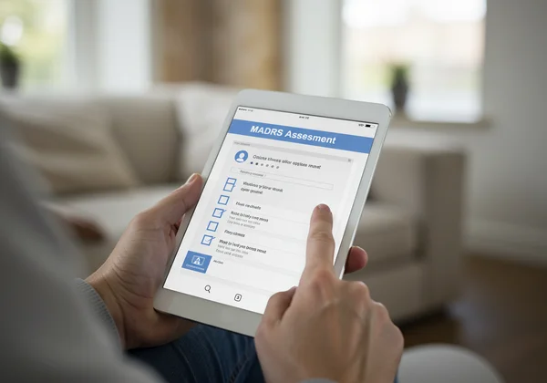 Person taking a MADRS online self-report test